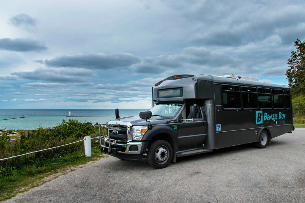 Benzie bus on a flat landscape by the water